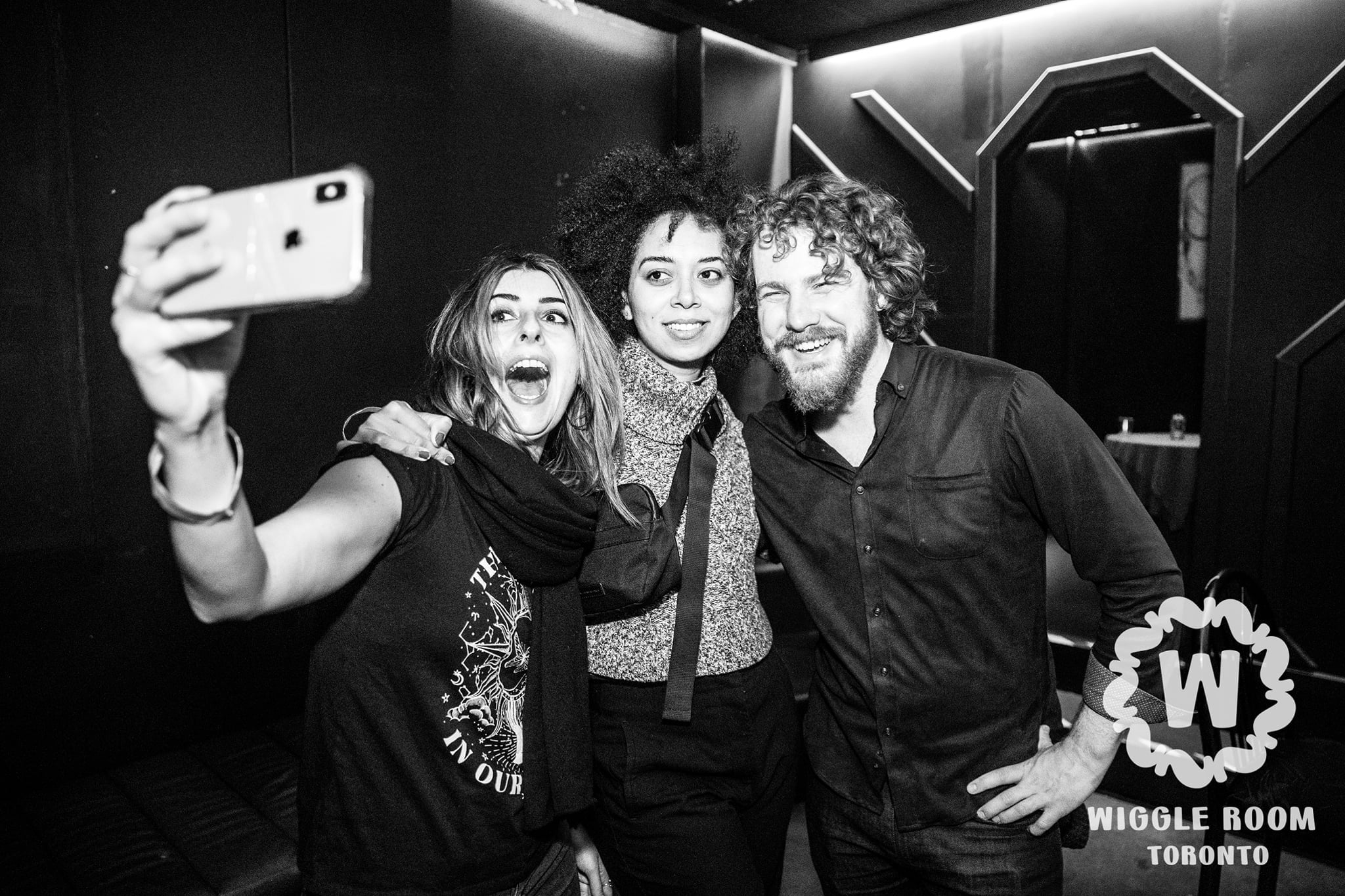 A group doing a selfie in washroom