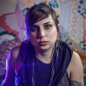 Portrait of artist in black sleeveless