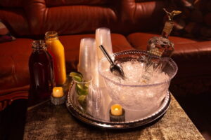 A bottle of vodka in an transparent bowl of ice