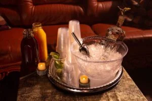 A bottle of vodka in an transparent bowl of ice