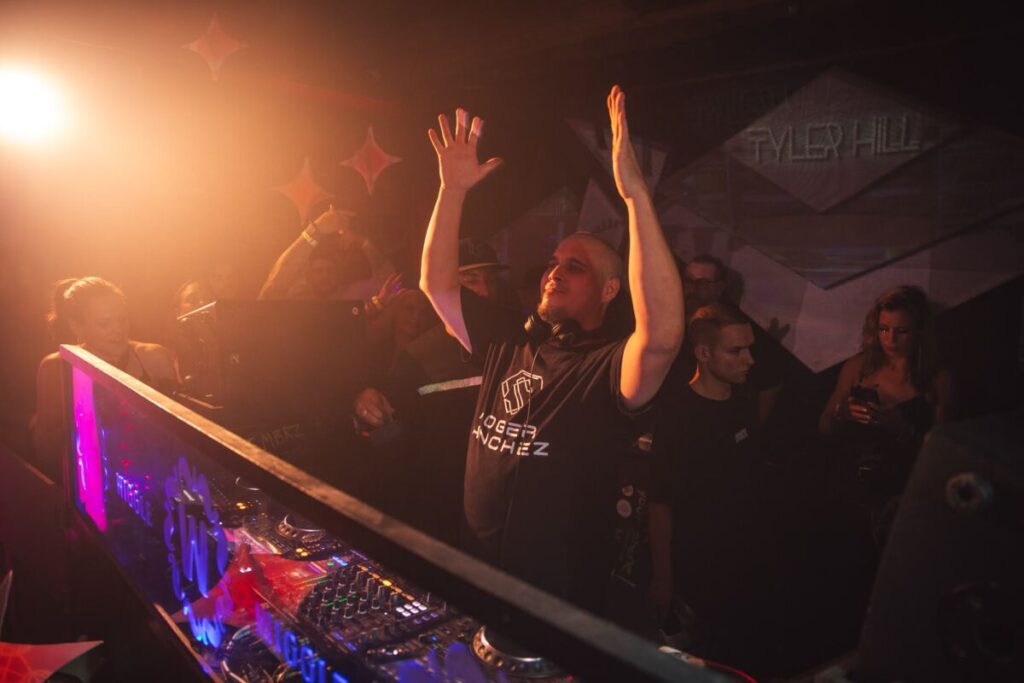 DJ with his hands in the air