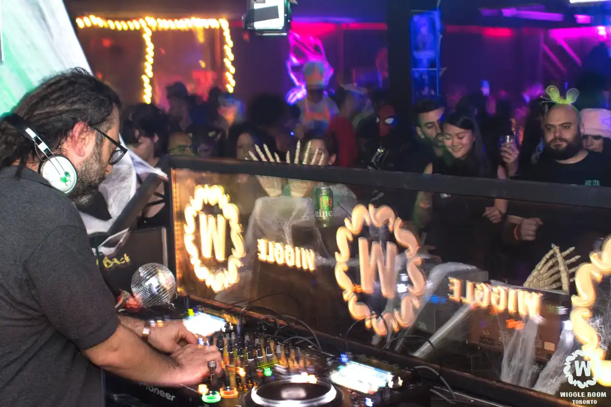DJ with dance crowd at Halloween