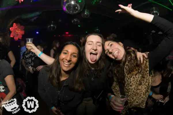 Three friends with tongues out