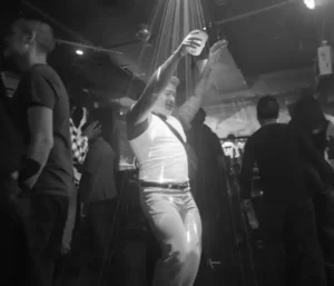 Man in whiteT dancing