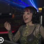 DJ laughing with hand up