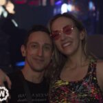 A couple, one with tinted glasses