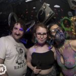 Three people one with mask