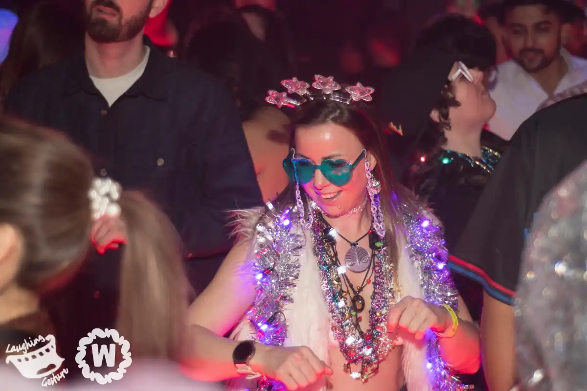 A sparkly woman dancing on NYE