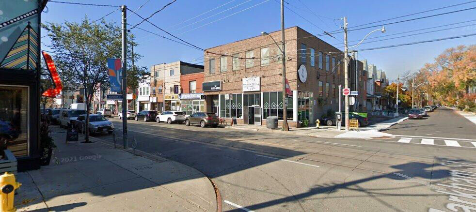 Daytime exterior on Dundas St W at Markham St a block west of Bathurst St