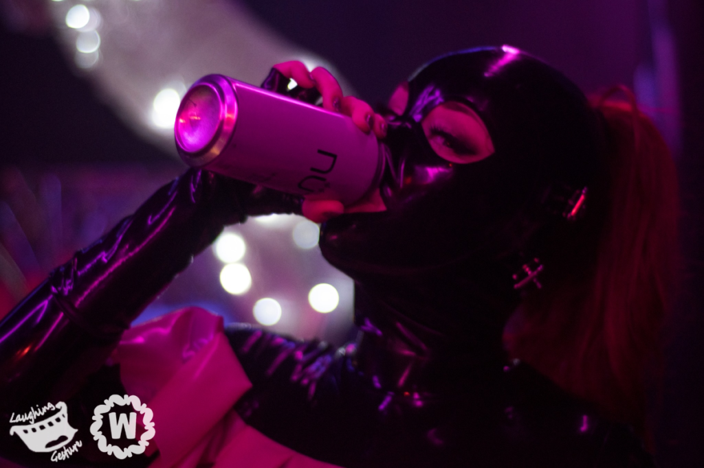 Rubber woman drinking a can of beer