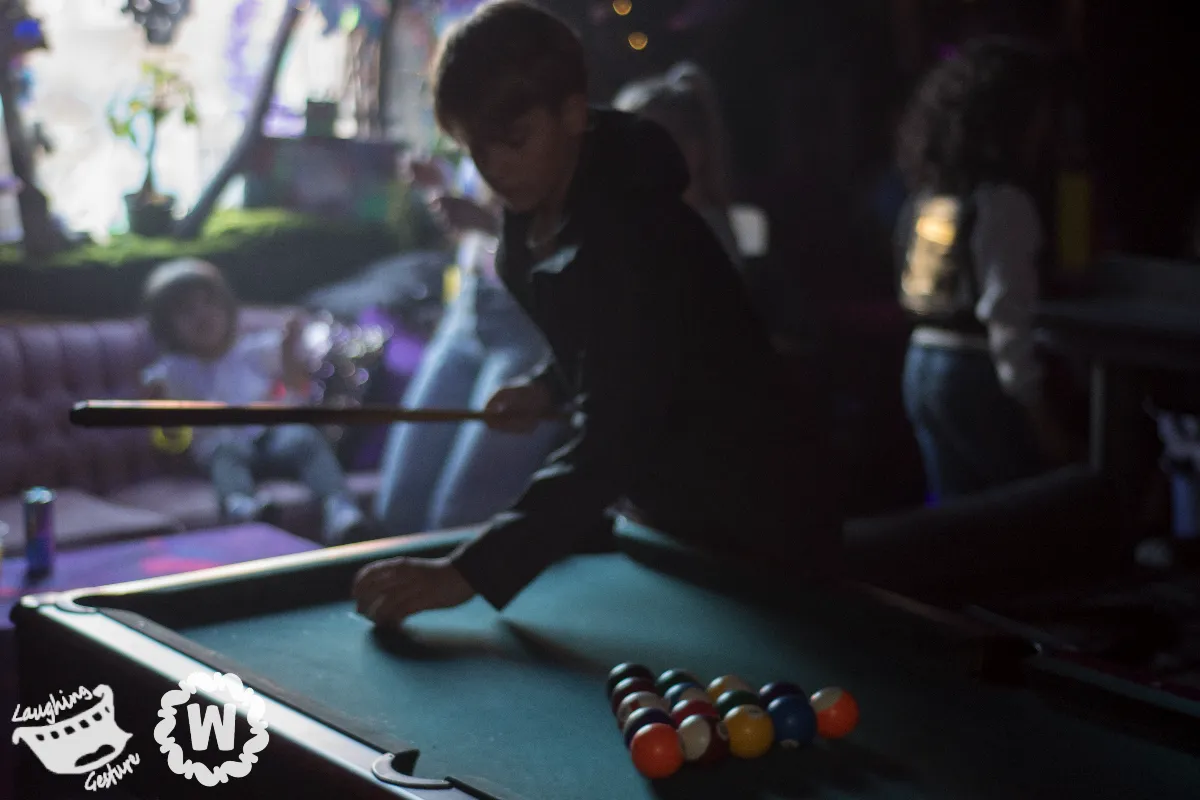 Kid playing pool