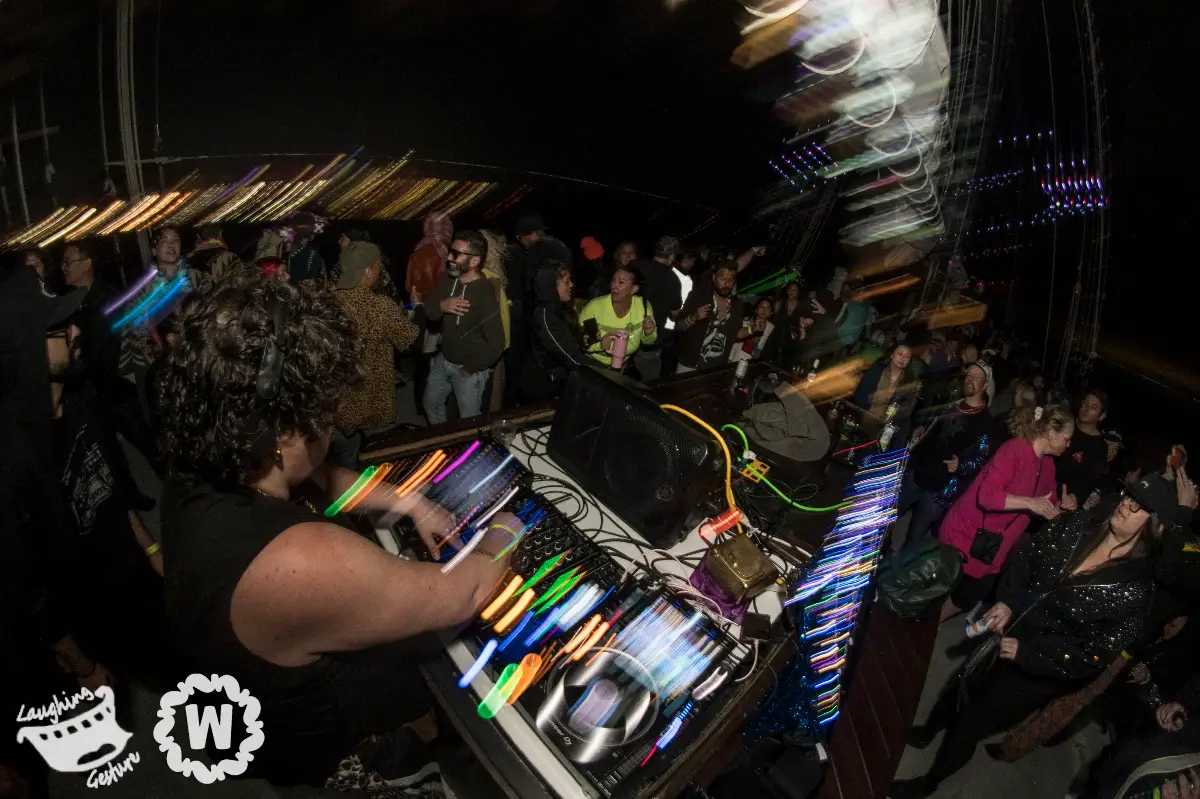DJ and crowd on a boat