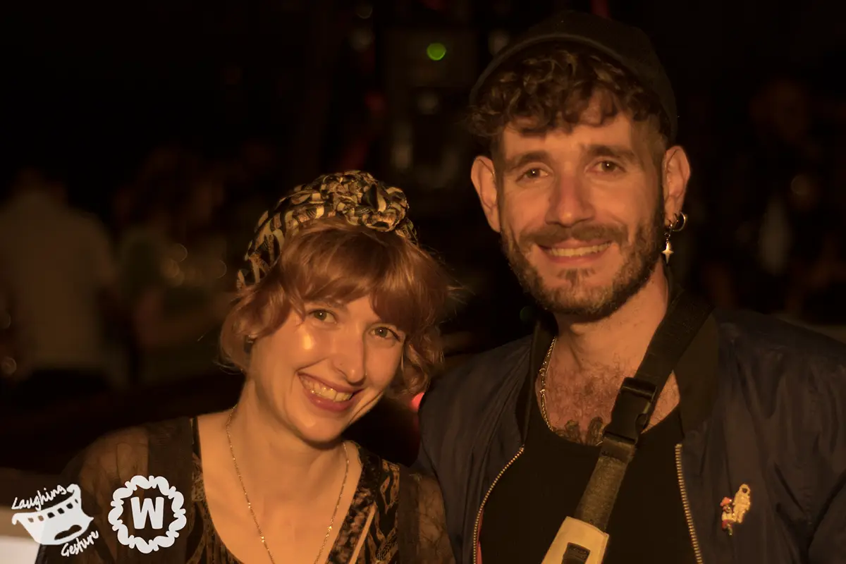 Couple smiling at the Annual Moonlight Cruise event.